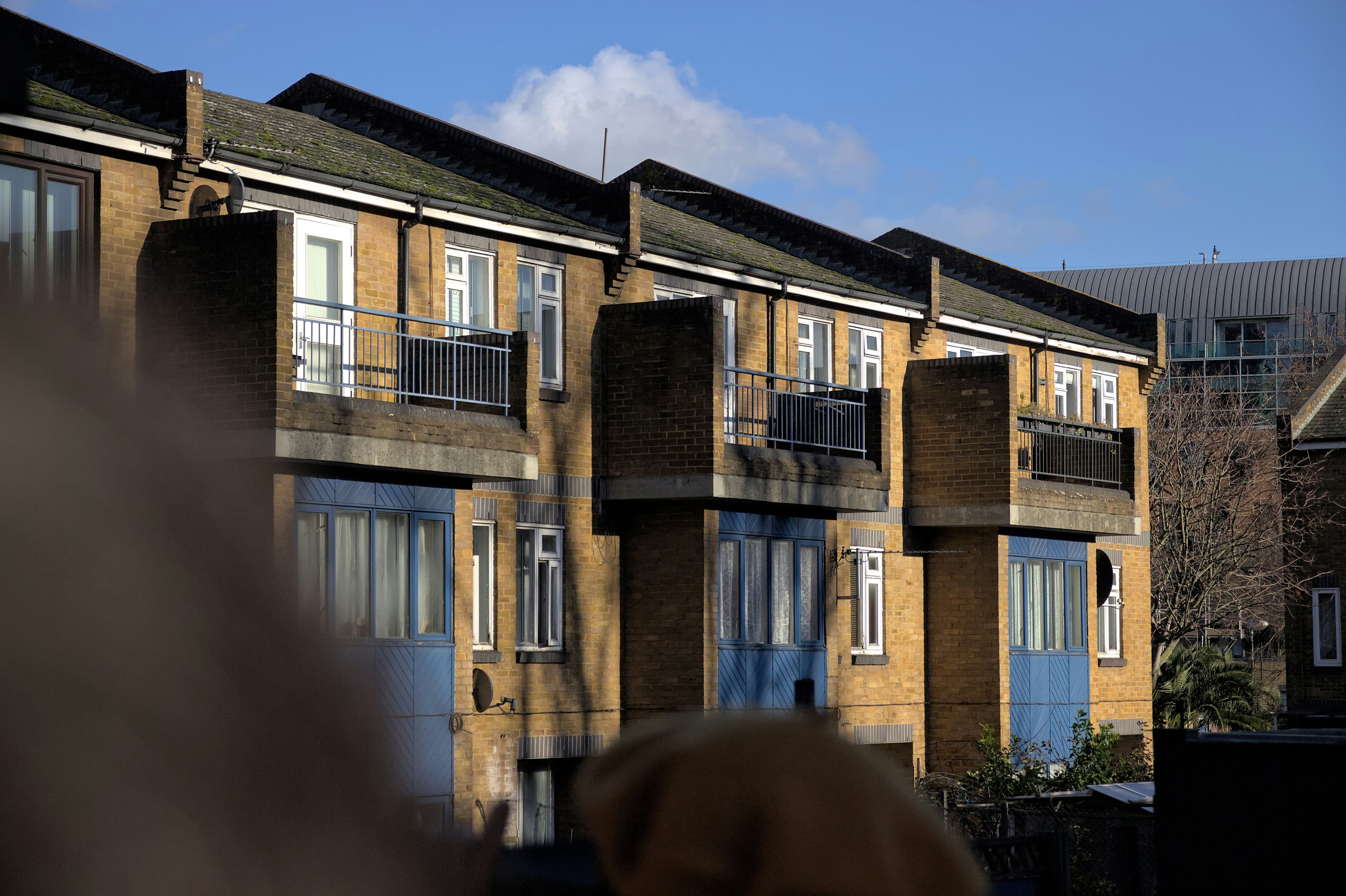 Jimgos Construction maintenance engineers outside a London housing block
